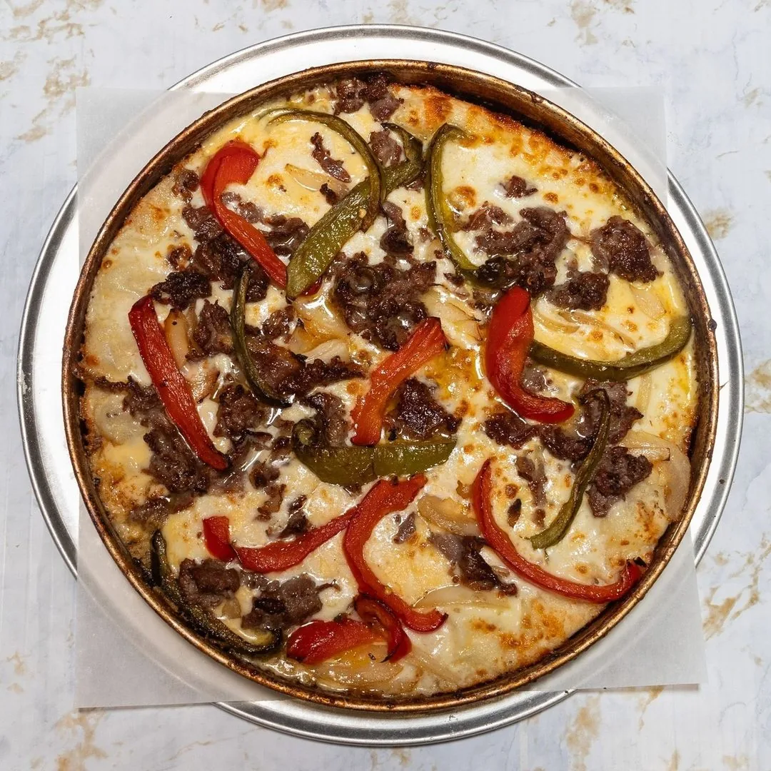 The Legend specialty pizza with shaved steak, peppers, onions, and mushrooms